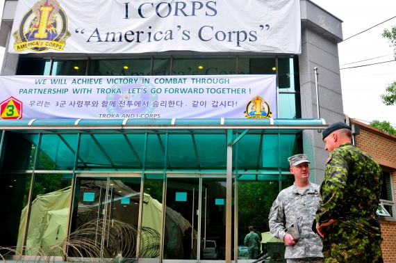 Major General Dean Milner (right), Commanding General 1st Canadian Division, is greeted by Brig. Gen. Kurt Ryan (left), Commanding General for the 593rd Expeditionary Sustainment Command, outside the joint operations center in preparation for the Ulchi Freedom Guardian exercise at Camp Yongin, South Korea, Aug. 20. (DOD Photo / Daniel Schroeder)