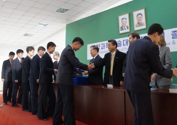 Students accept degrees during a graduation ceremony at the Pyongyang University of Science and Technology on November 19, 2014 (Photo: PUST)