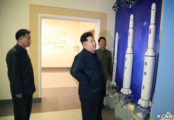 Kim Jong Un looks at models of Unha rocket at the General Satellite Control and Command Centre in this undated picture carried by KCNA on May 3, 2015.